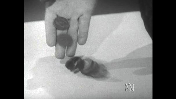 Hand drops coins onto table