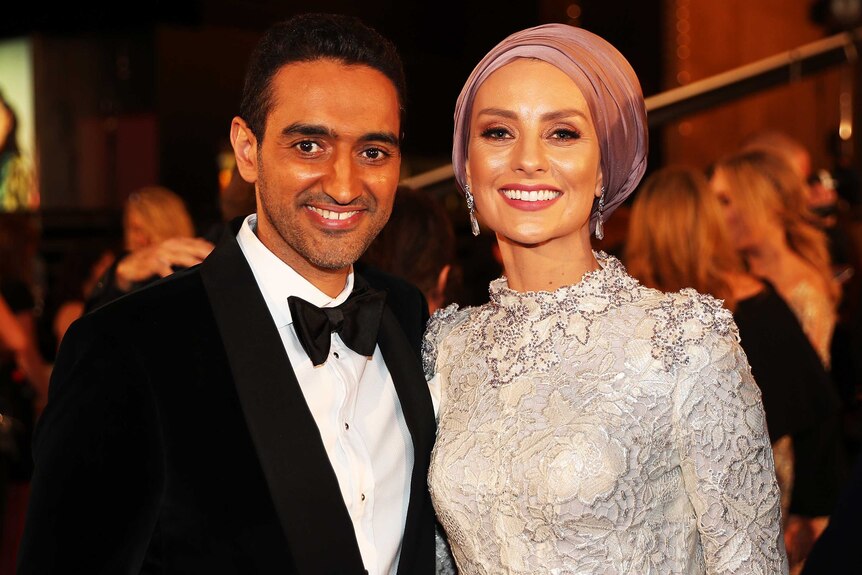 Waleed Aly and his wife susan pose in the foyer of melbourne's crown casino