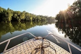 A boat travelling down the Ord River in the east Kimberley.