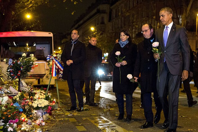 Francois Hollande and President Obama place flowers outside the Bataclan