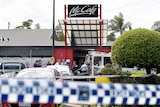 Emergency crews attend the scene of a shooting at a Gold Coast McDonald's