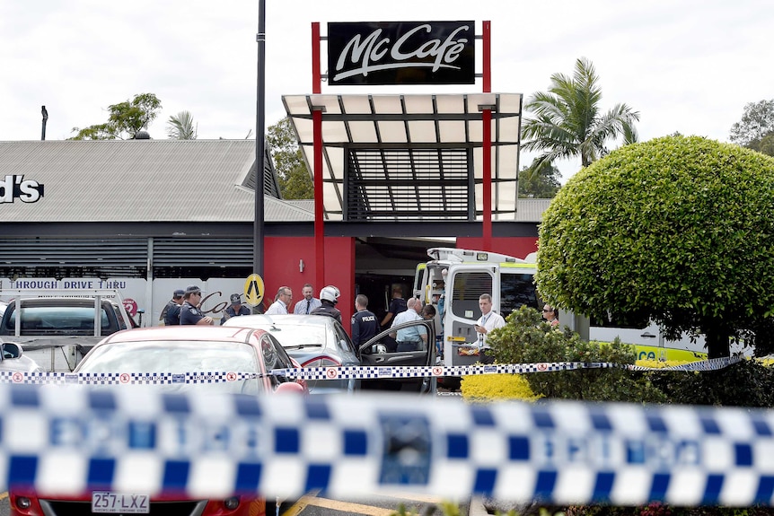 Emergency crews attend the scene of a shooting at a Gold Coast McDonald's