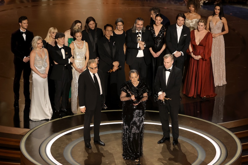 The cast of Oppenheimer along with its producers onstage to accept the Oscar for Best Picture.