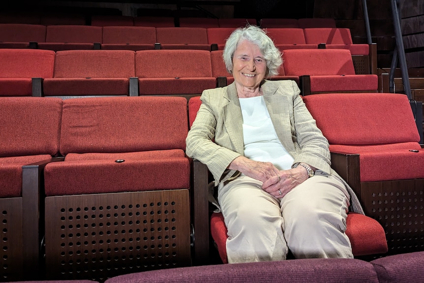 Cate Whittaker seated in a theatre.