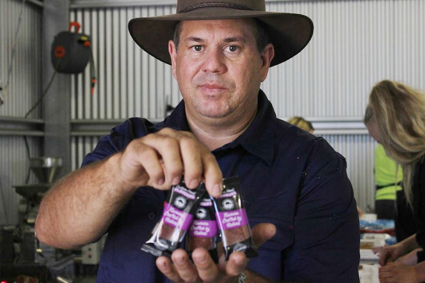 Bevan Eatts holding his fruit leather product.