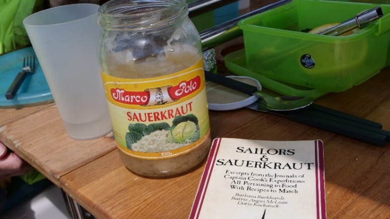 The book Sailors and Sauerkraut pictured on the table of yacht Isa Lei.