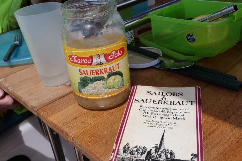 The book Sailors and Sauerkraut pictured on the table of yacht Isa Lei.