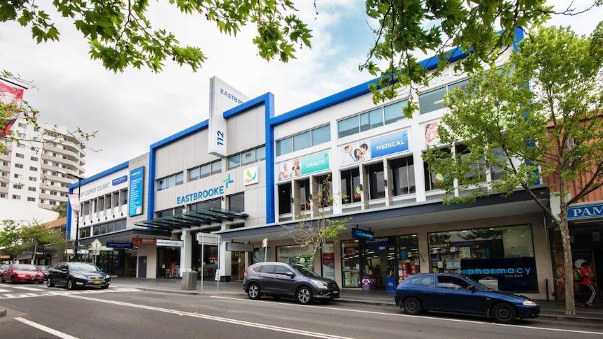 a white building with the words eastbrooke health and medical