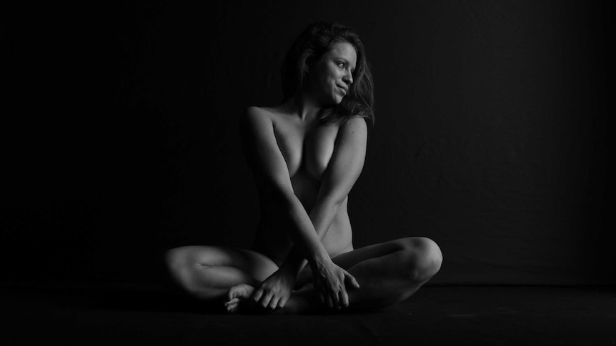 Woman in nude yoga pose.