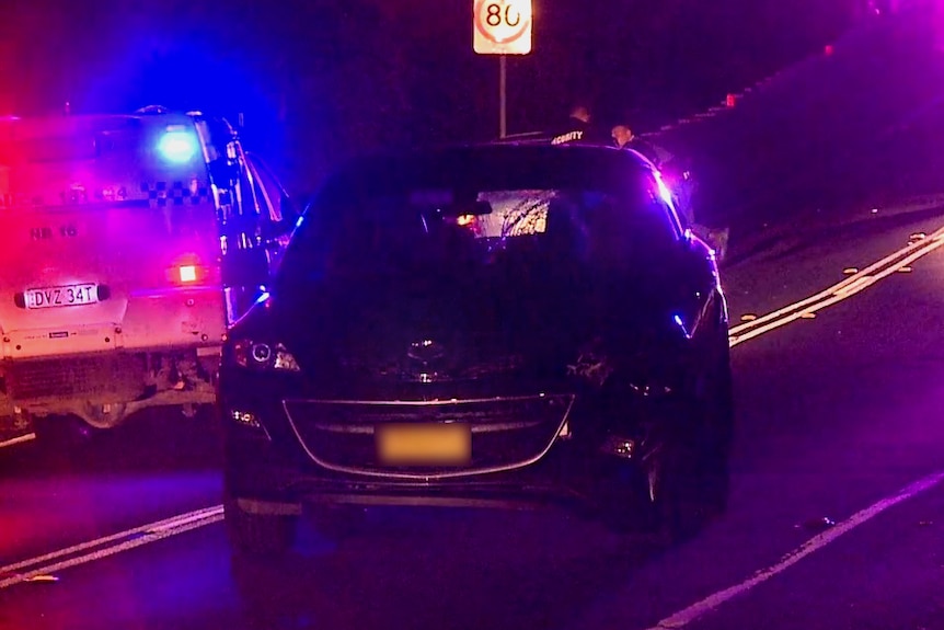 car with damaged windshield on night road