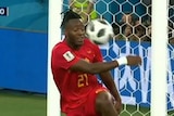 A soccer ball rebounding into Belgium striker Michy Batshuayi's face.