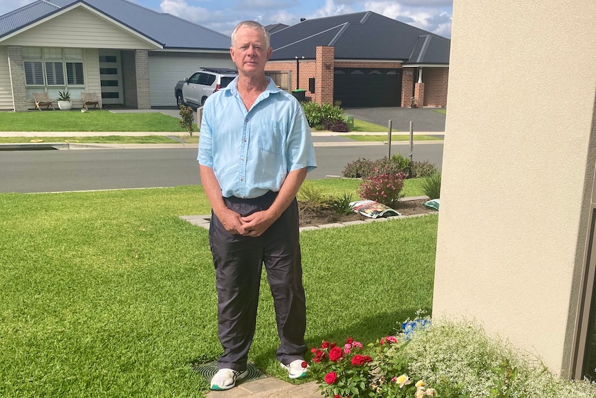 A man standing on a lawn