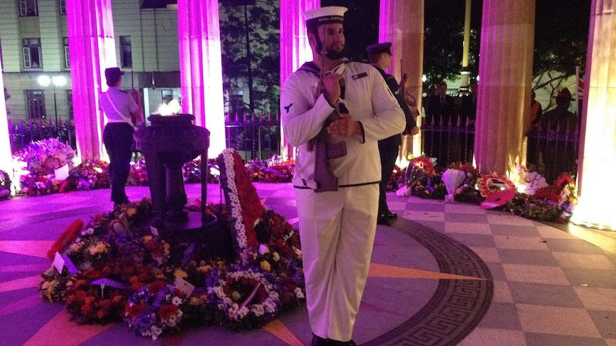 The catafalque party guards the Anzac Square Shrine of Remembrance during the dawn service
