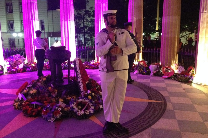 The catafalque party guards the Anzac Square Shrine of Remembrance during the dawn service