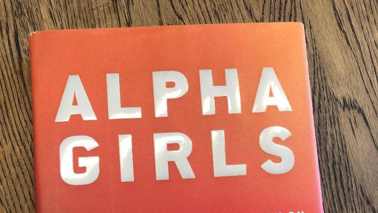 The cover of Julian Guthrie's book Alpha Girls, red with silver and white writing