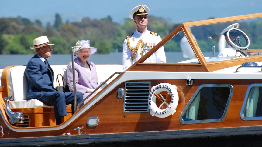 The Queen and Prince Phillip cruise across Canberra's Lake Burley Griffin.