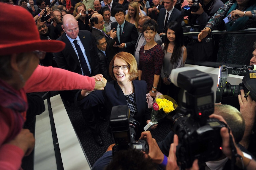 Julia Gillard shakes hands with party members following a speech at the University of Western Sydney (AAP: Paul Miller)