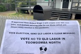 A flyer encouraging people to 'vote no' to QLD labor in a letter box.