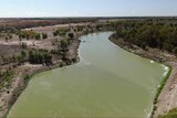 A shot of a full river, taken from a drone.