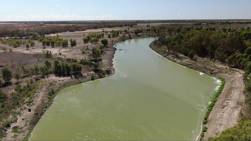 A shot of a full river, taken from a drone.