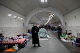 People gather in the Kyiv subway, using it as a bomb shelter in Kyiv, Ukraine.