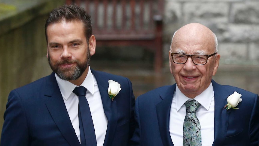 Lachlan and Rupert Murdoch both wear navy suits