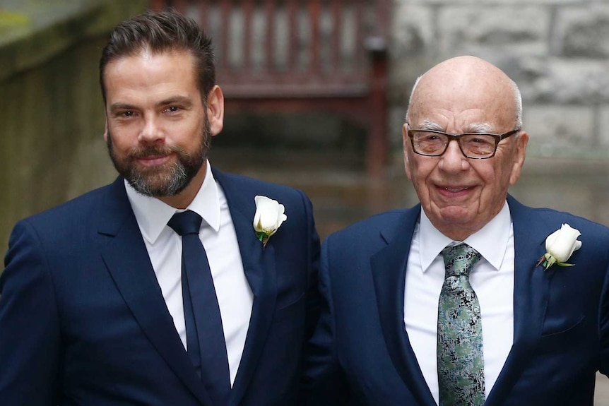 Lachlan and Rupert Murdoch both wear navy suits