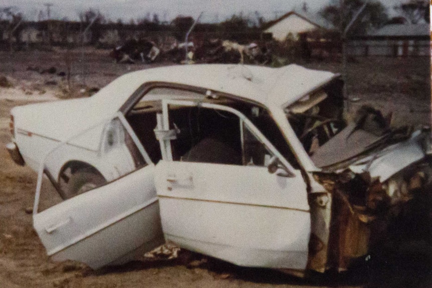 A white sedan completely wrecked after a car accident that claimed the life of Michael Boyd's best friend.