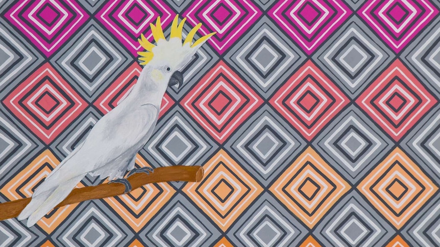 A painting of a cockatoo in front of a brightly coloured patterned background