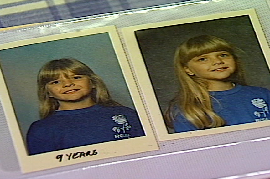 Two side by side photographs of a young girl in a blue school uniform in a photo album.