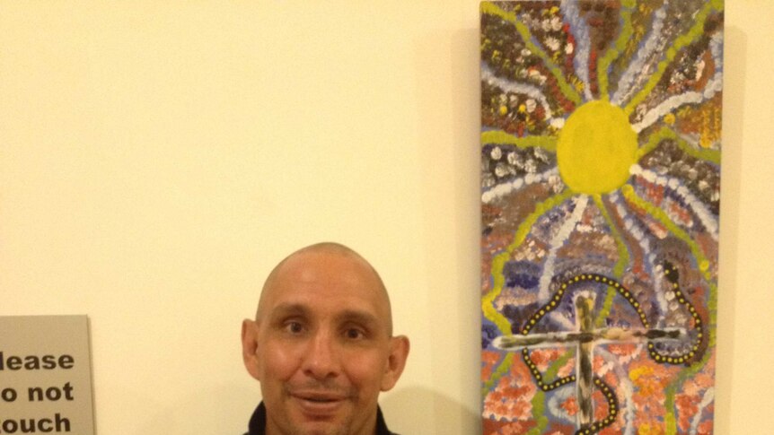 David Dowden and one of his paintings.