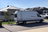 A police van outside a house.