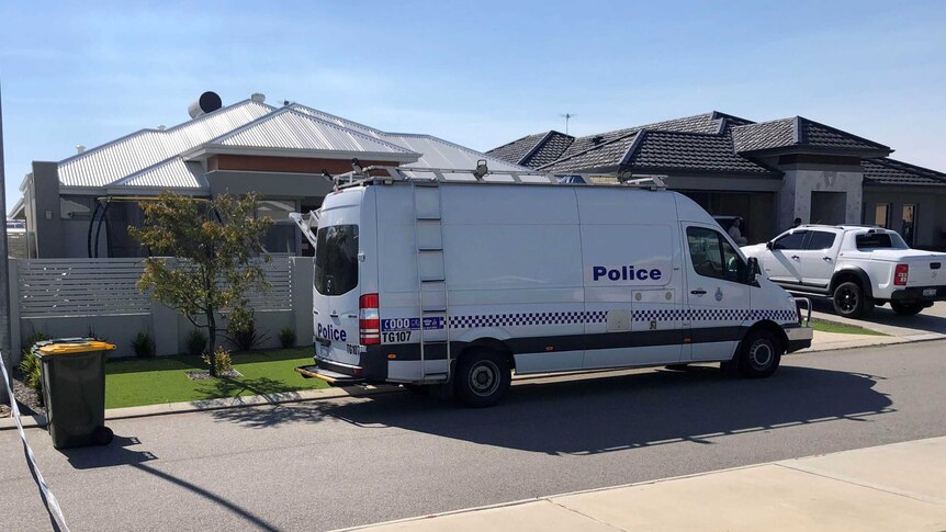 A police van outside a house.