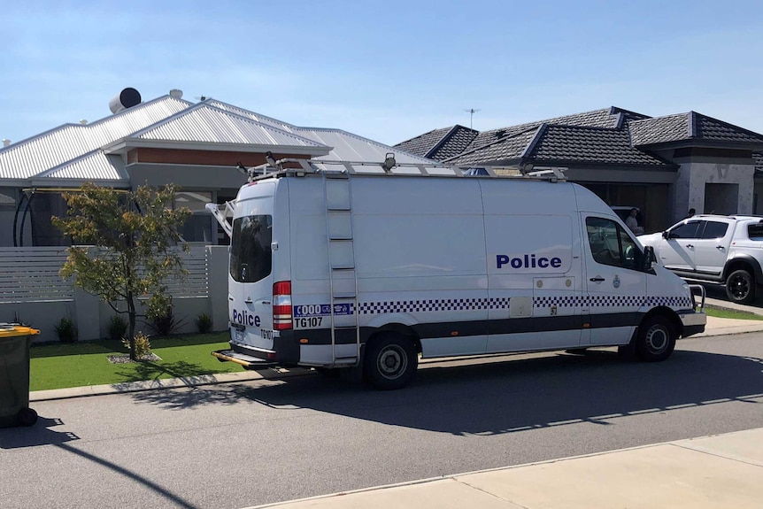 A police van outside a house.