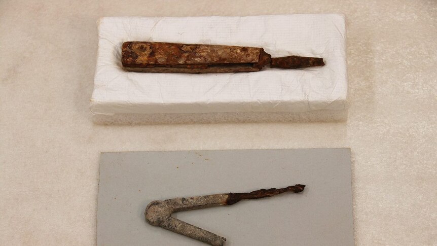 A bone handled tool and a compass from the Port Arthur dig.