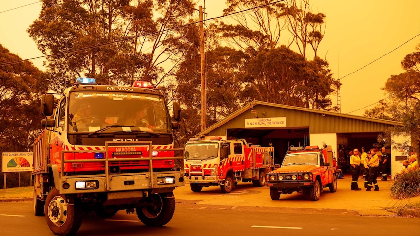 Firefighters leave Narooma station headed to help fight the blazes threatening the area.