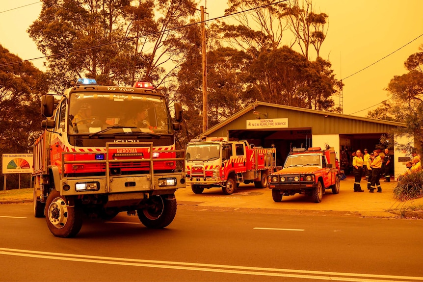 Firefighters leave Narooma station headed to help fight the blazes threatening the area.