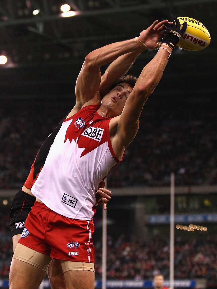 Sydney big man Mike Pyke takes a mark against the Bombers.
