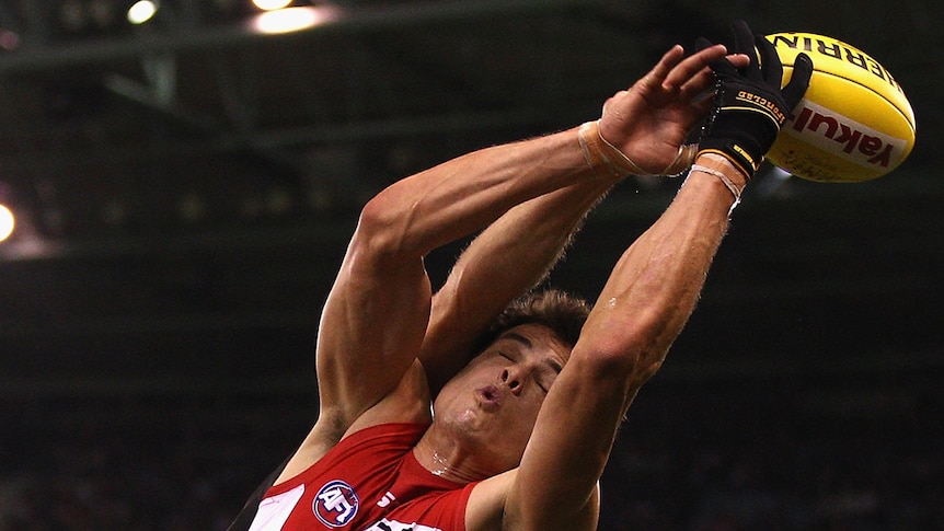 Sydney big man Mike Pyke takes a mark against the Bombers.