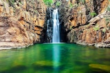 A waterfall falls into the Southern Rockhole at Nitmiluk National Park in the Northern Territory.