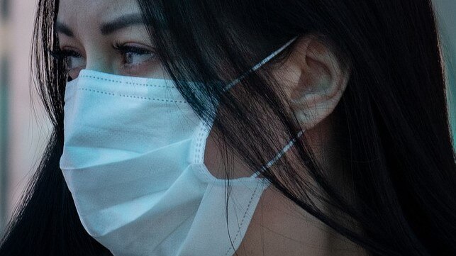 Unidentified female wearing a respiratory mask.