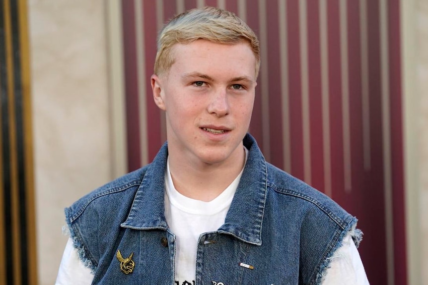 Teenage boy smiling at camera 