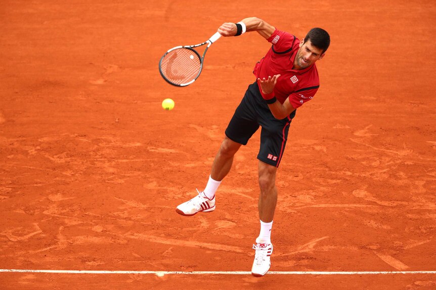 Novak Djokovic serves against Lu Yen-Hsun at the French Open
