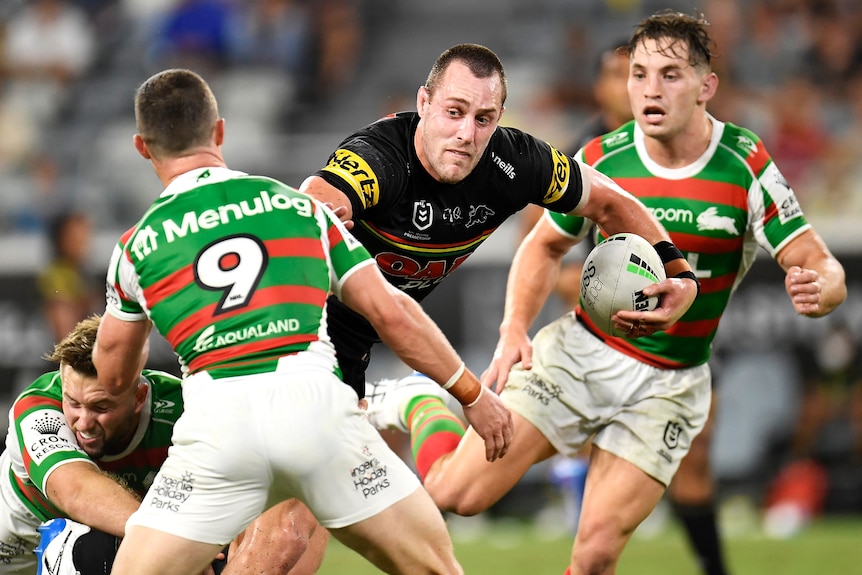 Penrith Panthers' Isaah Yeo tries to run through the South Sydney Rabbitohs' defence.