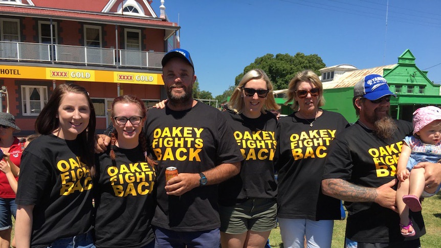 Crowds gathering for Oakey Fights Back rally, to try to restore image during defence contamination crisis.