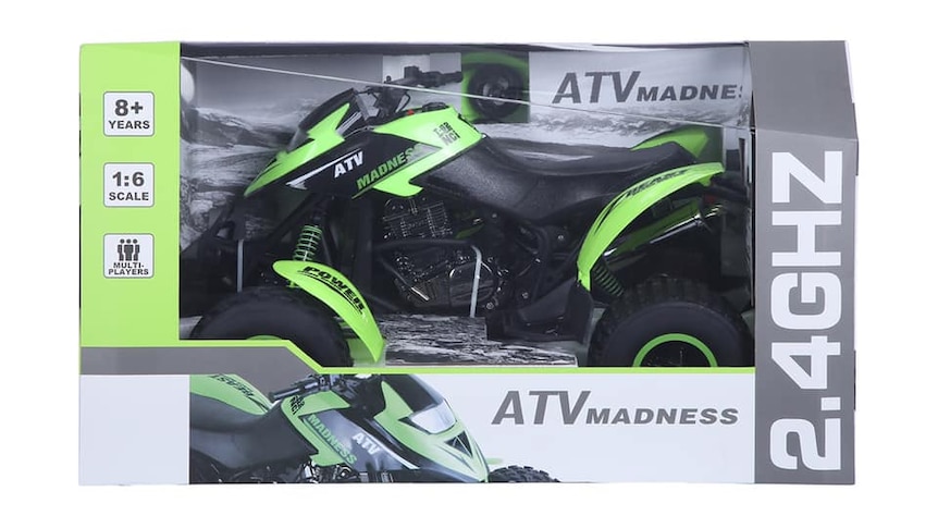 A green remote controlled quad bike toy in packaging.