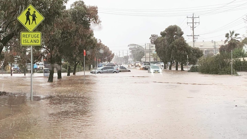 Cars parked in floodwater in downtown Broken Hill.