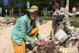 Rick Thomsom-Jones with an Easter beach sculpture in Port Macquarie.
