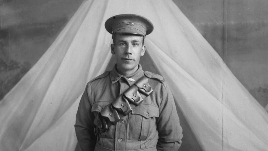 A young man in 1910s military uniform.