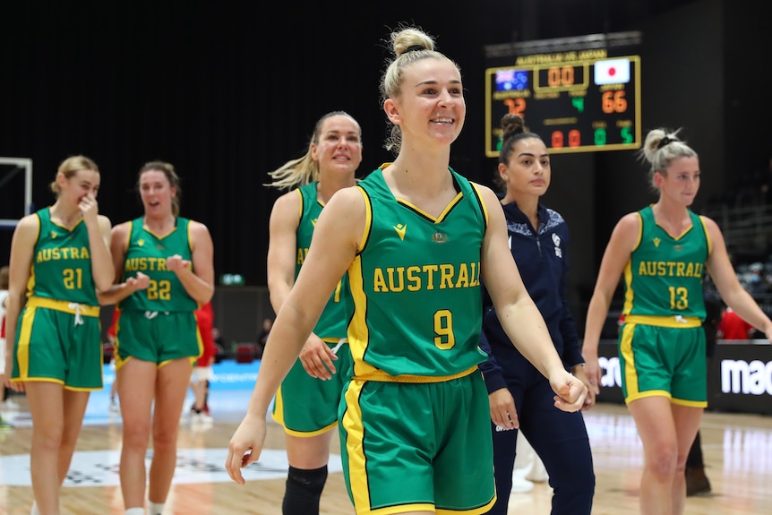 Stephanie Reid walks off the court followed by her teammates.